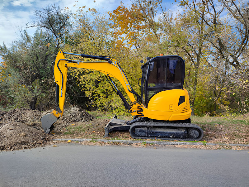 Mini Excavator Digging the Road