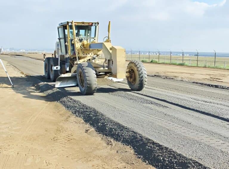 Motor grader working on airport runway construction