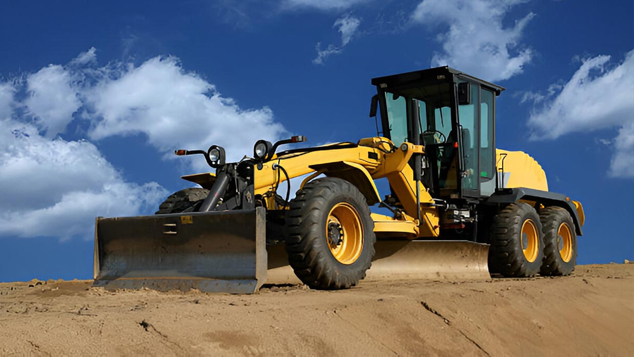 desi machines small grader parked on site